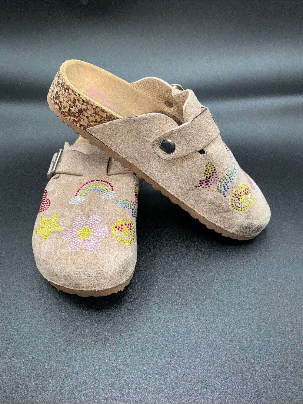 Yoki Gienna girls' taupe faux suede clogs featuring rhinestone embellishments.
